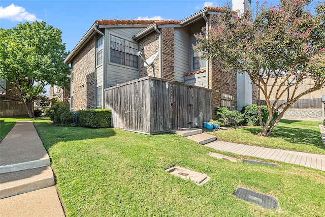 view of property exterior with a lawn