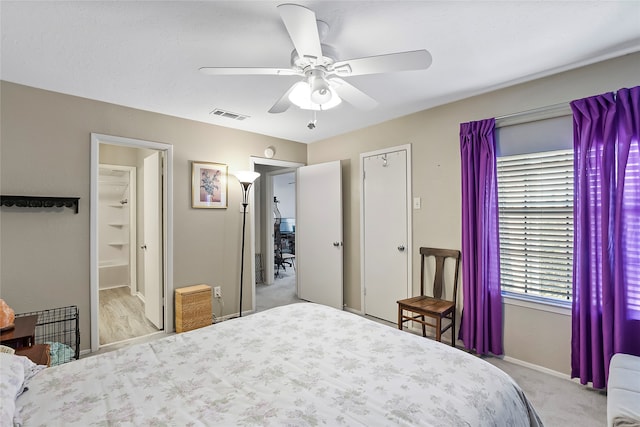 bedroom featuring light colored carpet and ceiling fan