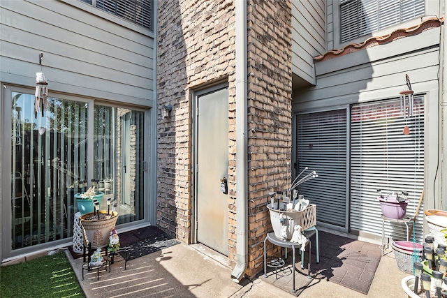 property entrance with a patio