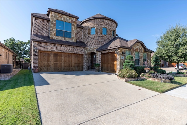 view of front of house with a front yard, a garage, and cooling unit