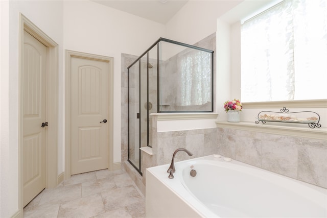 bathroom with separate shower and tub