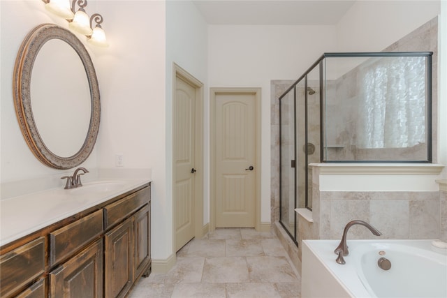 bathroom featuring vanity, tile patterned flooring, and separate shower and tub