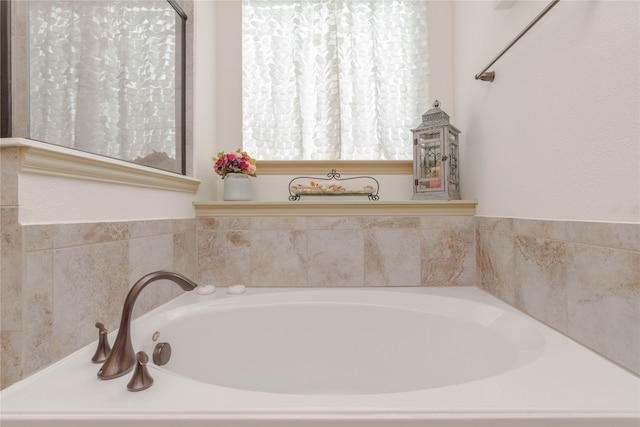 bathroom with a tub to relax in