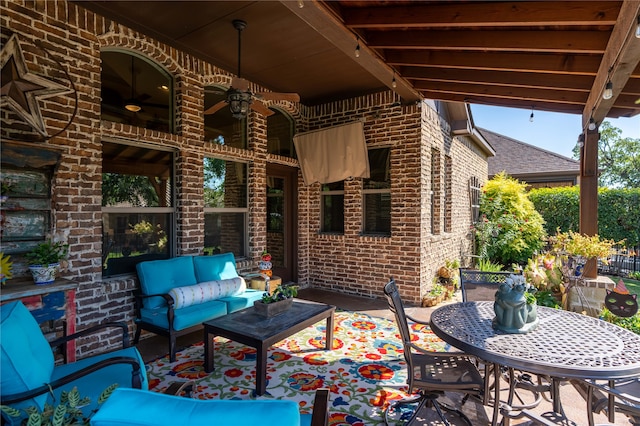 view of patio with outdoor lounge area and ceiling fan