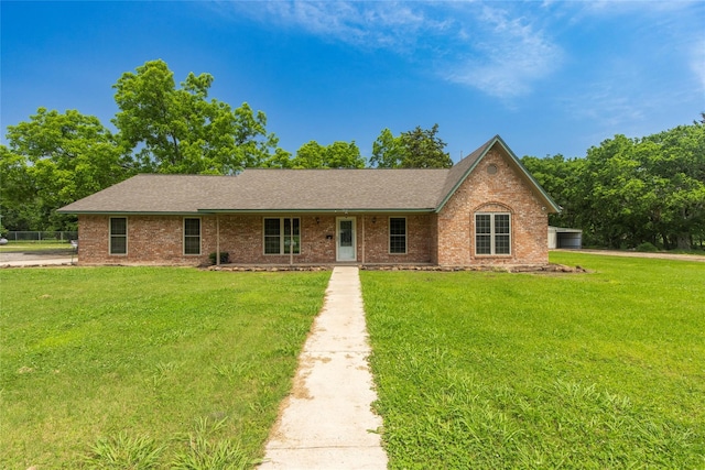 single story home featuring a front yard