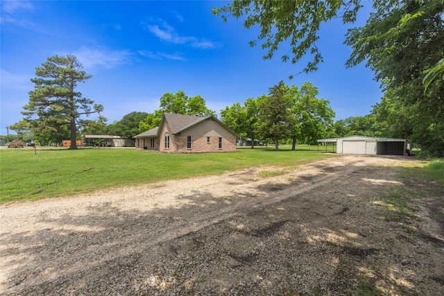 view of property exterior with a lawn and an outdoor structure