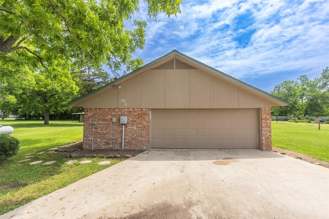 view of home's exterior with a yard and a garage