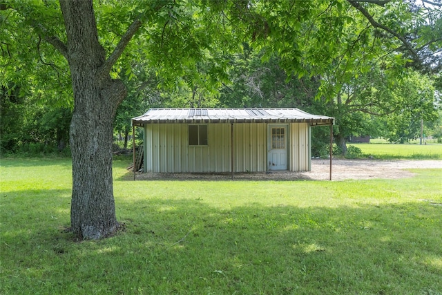 view of outbuilding with a lawn