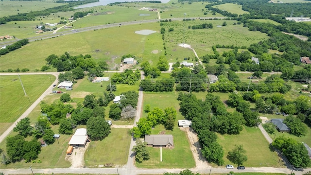 birds eye view of property with a rural view