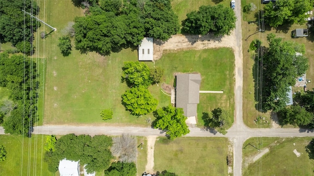 birds eye view of property with a rural view