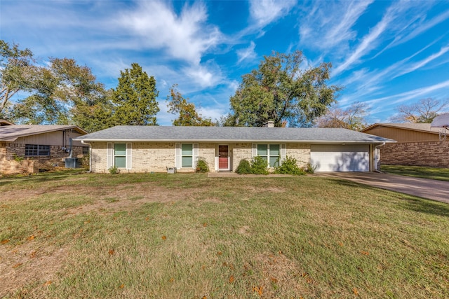 ranch-style home with a front yard and a garage