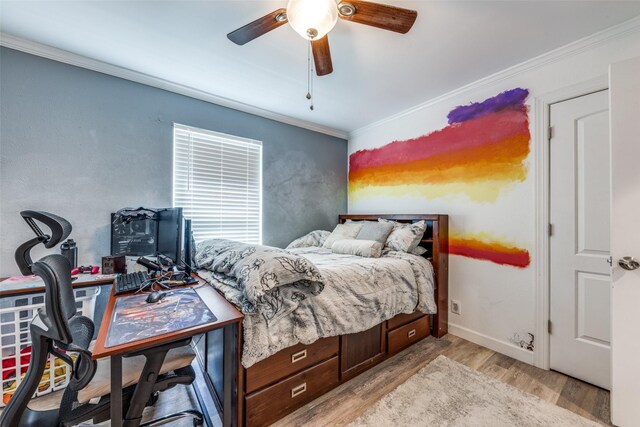 bedroom with ceiling fan, ornamental molding, baseboards, and light wood-type flooring