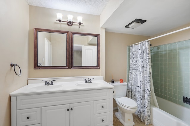 full bathroom with shower / bath combo, vanity, toilet, and a textured ceiling