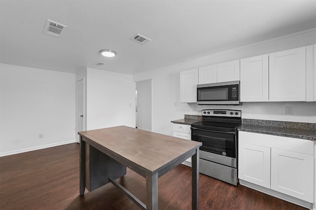 kitchen featuring white cabinetry, stainless steel appliances, and dark wood-type flooring