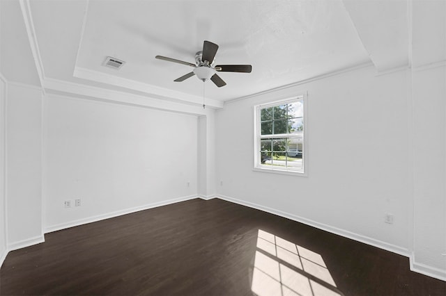 unfurnished room featuring ornamental molding, dark hardwood / wood-style floors, and ceiling fan