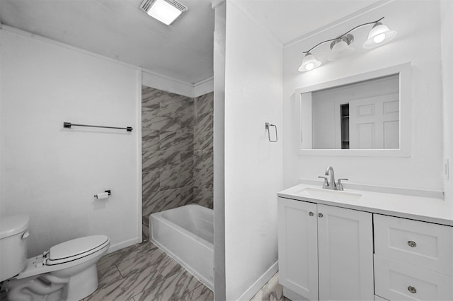 bathroom with toilet, ornamental molding, and vanity