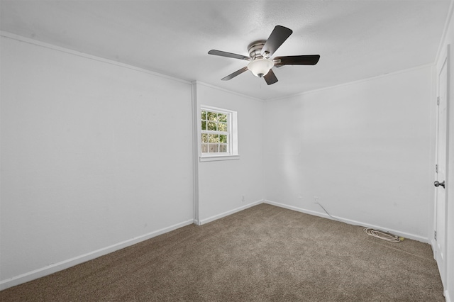 unfurnished room featuring ornamental molding, carpet, and ceiling fan