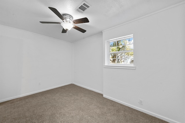 carpeted empty room with ceiling fan, a textured ceiling, and ornamental molding