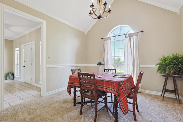 dining space with crown molding, vaulted ceiling, an inviting chandelier, and light colored carpet