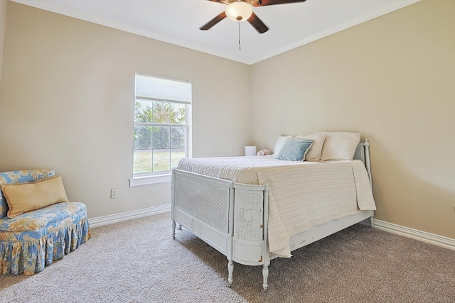 carpeted bedroom featuring ornamental molding and ceiling fan