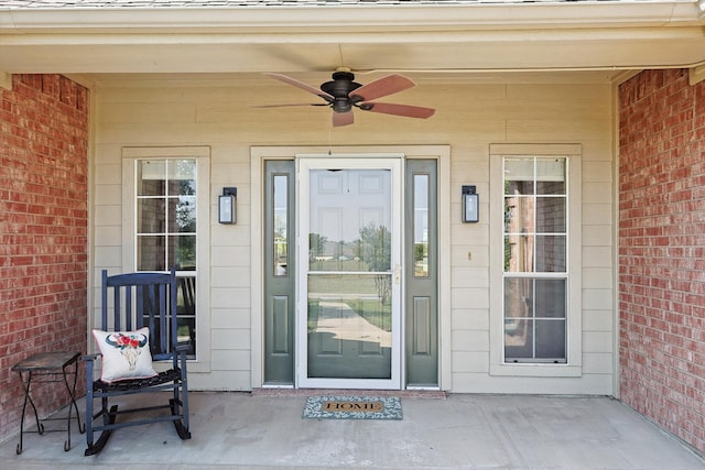 view of exterior entry with ceiling fan