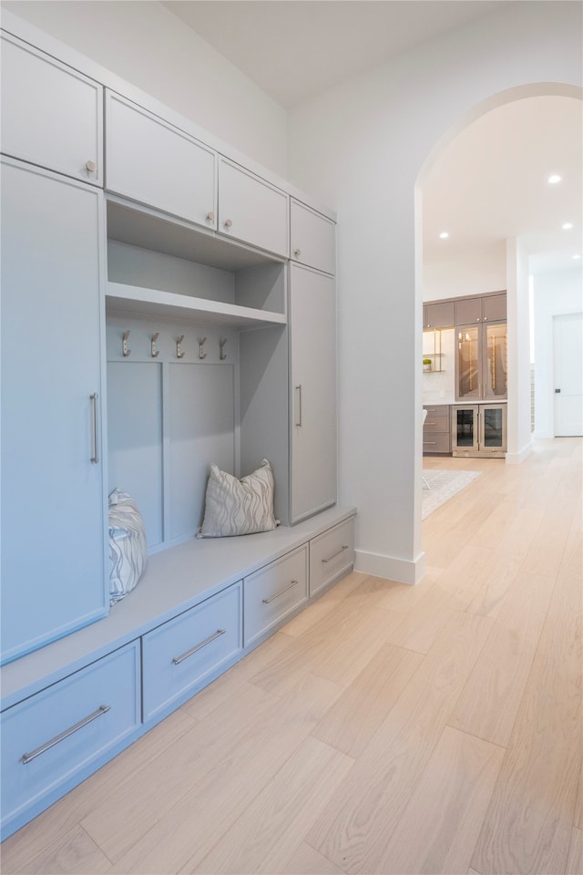 mudroom with light hardwood / wood-style floors