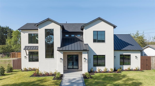 modern inspired farmhouse featuring a front lawn