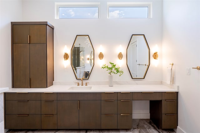 bathroom with plenty of natural light and vanity