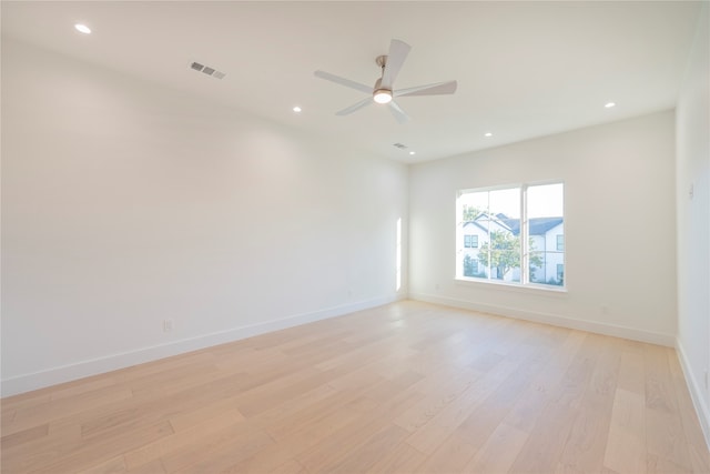 empty room featuring ceiling fan and light wood-type flooring