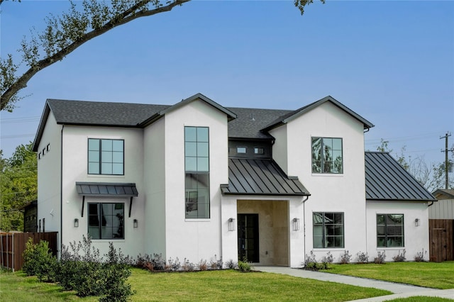 modern inspired farmhouse featuring a front yard