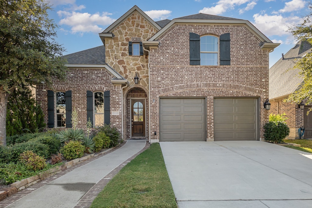 front facade with a garage