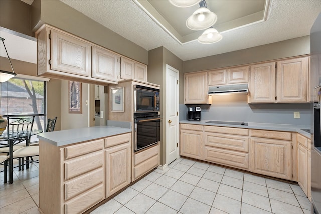 kitchen featuring black appliances, light brown cabinets, and a textured ceiling