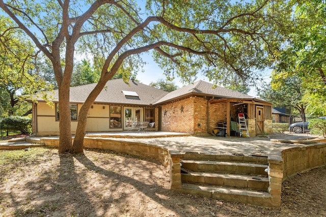 view of front of house with a patio area