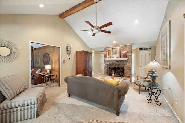 living room with a brick fireplace, beamed ceiling, ceiling fan, light carpet, and high vaulted ceiling