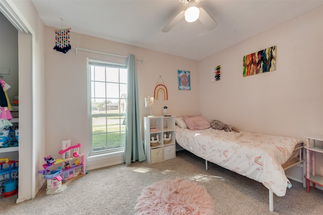 carpeted bedroom featuring ceiling fan