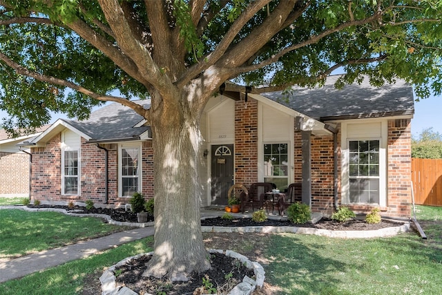 ranch-style home featuring a front yard