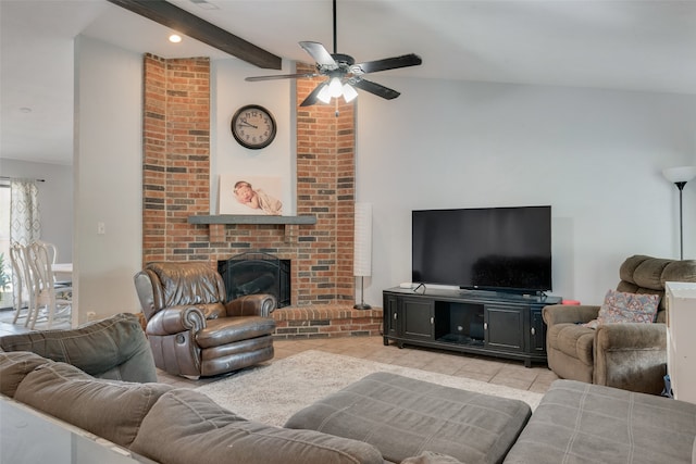 living room with ceiling fan, light tile patterned floors, a fireplace, and lofted ceiling with beams