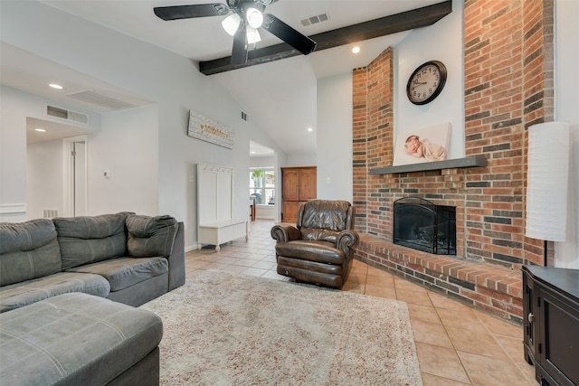 tiled living room with a brick fireplace, ceiling fan, and vaulted ceiling with beams