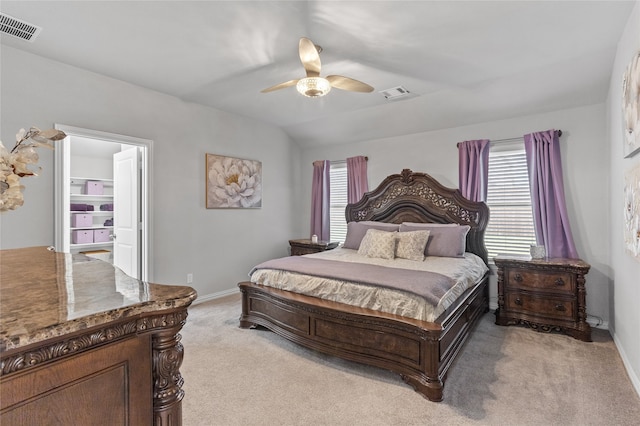 carpeted bedroom with multiple windows, lofted ceiling, and ceiling fan