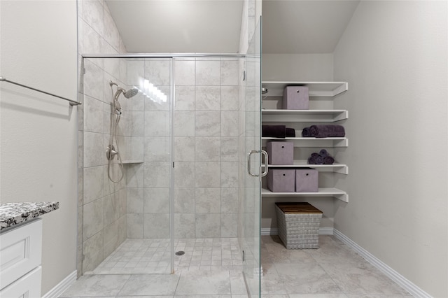 bathroom with tile patterned flooring and walk in shower