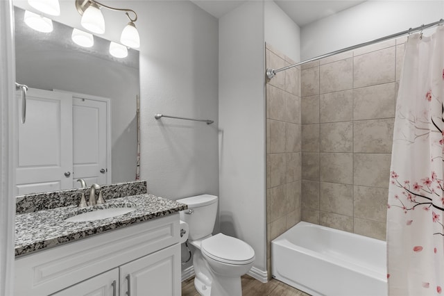 full bathroom featuring shower / bath combo, vanity, hardwood / wood-style flooring, and toilet