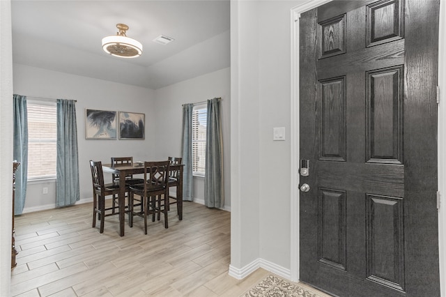 dining space featuring light wood-type flooring