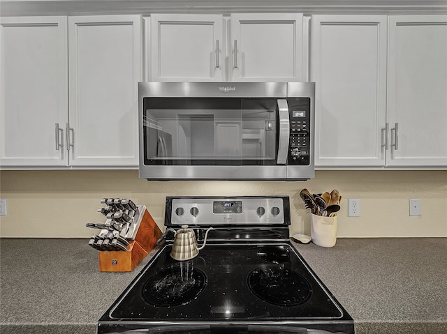 kitchen featuring white cabinetry and stainless steel appliances