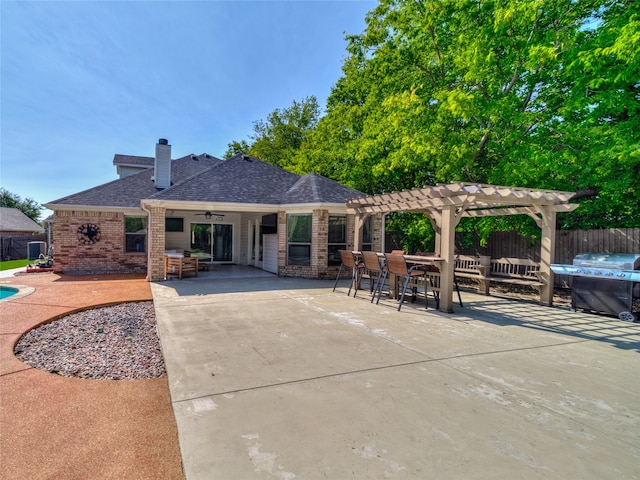 exterior space with a pergola and a patio