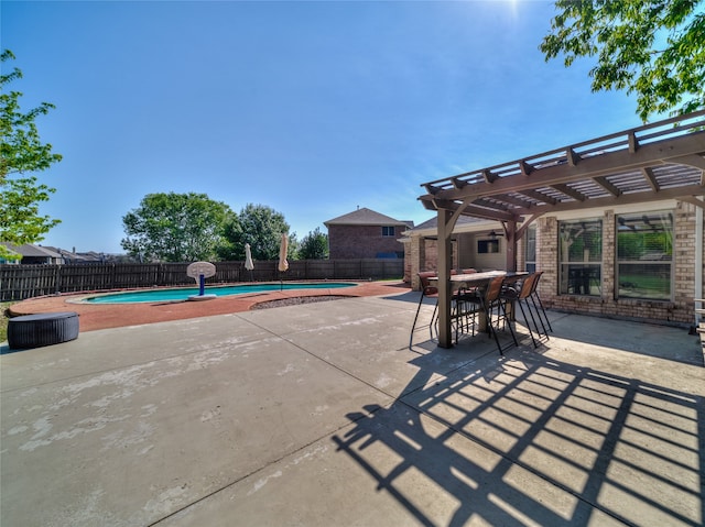 view of patio / terrace featuring a fenced in pool and a pergola