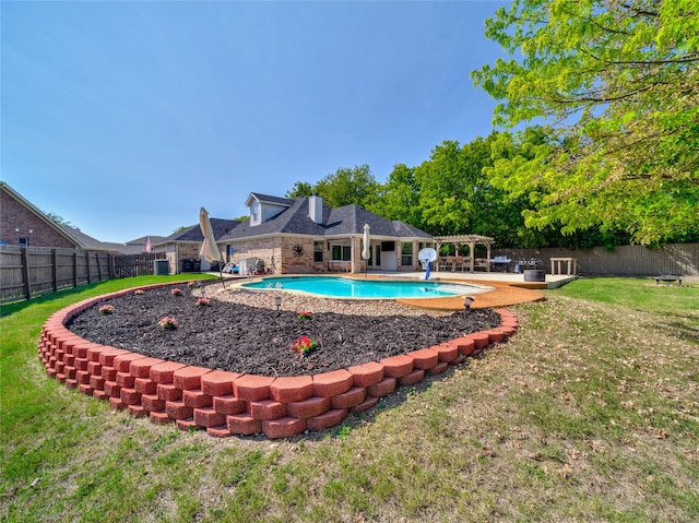 view of pool featuring a yard and a patio