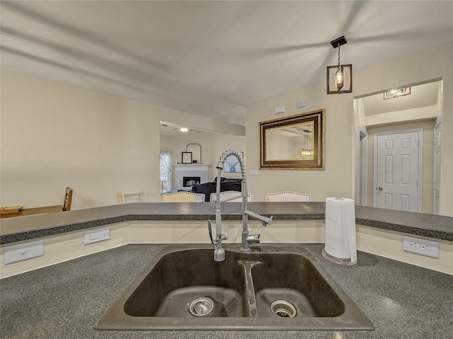 kitchen with decorative light fixtures and sink