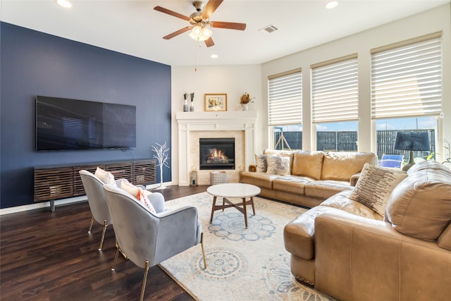 living room with ceiling fan and dark hardwood / wood-style flooring