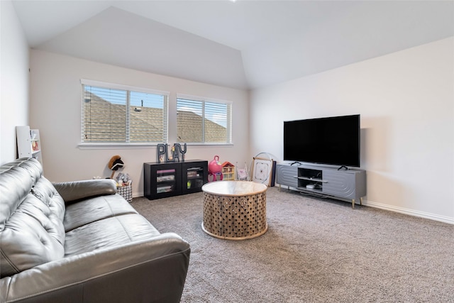 carpeted living room featuring vaulted ceiling