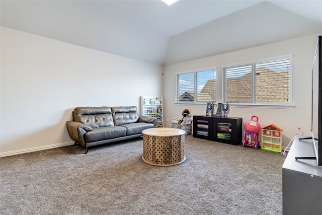 carpeted living room with vaulted ceiling